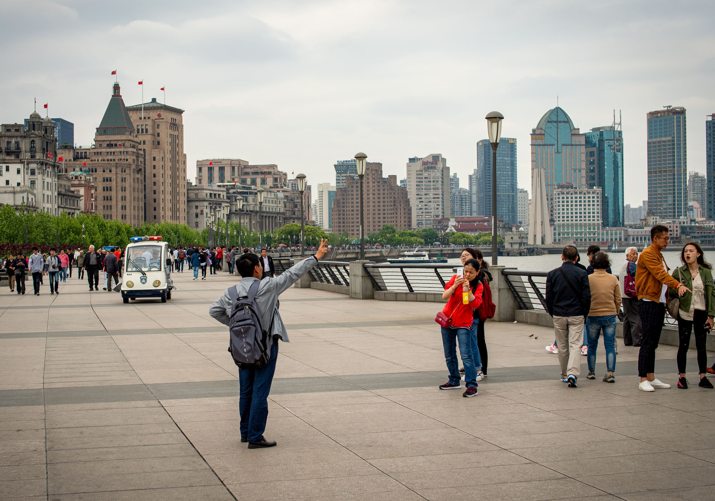Visitors walking along the Bund in Shanghai